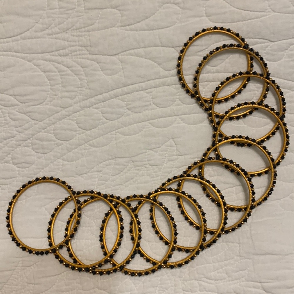 Black and gold colored fashion bangles